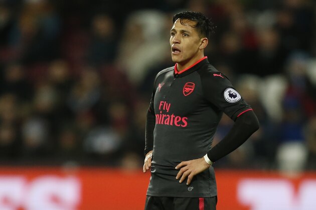 Arsenal's Chilean striker Alexis Sanchez looks on during the English Premier League football match between West Ham United and Arsenal at The London Stadium, in east London on December 13, 2017. / AFP PHOTO / Ian KINGTON / RESTRICTED TO EDITORIAL USE. No use with unauthorized audio, video, data, fixture lists, club/league logos or 'live' services. Online in-match use limited to 75 images, no video emulation. No use in betting, games or single club/league/player publications.  /         (Photo credit should read IAN KINGTON/AFP/Getty Images)
