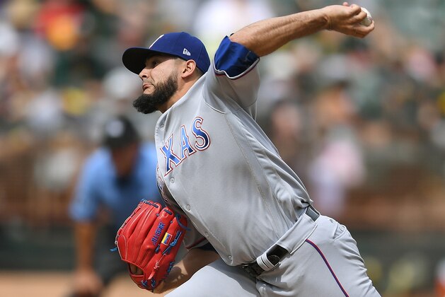 OAKLAND, CA - SEPTEMBER 24:  Martin Perez #33 of the Texas Rangers pitches against the Oakland Athletics in the bottom of the first inning at Oakland Alameda Coliseum on September 24, 2017 in Oakland, California.  (Photo by Thearon W. Henderson/Getty Images)