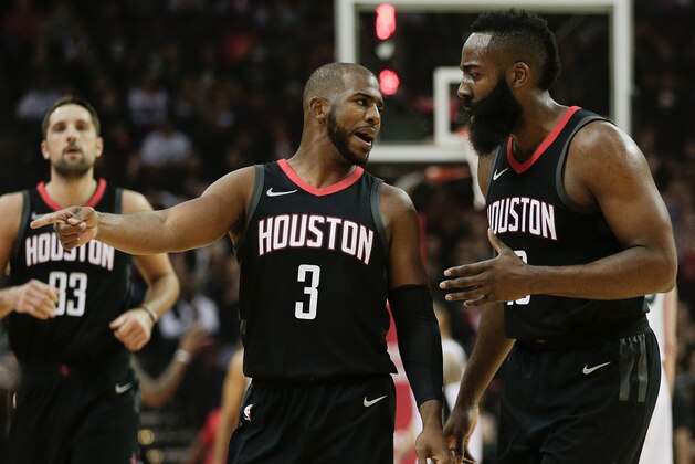 HOUSTON, TX - DECEMBER 15:  Chris Paul #3 of the Houston Rockets taoks with James Harden #13 as they go to a time out against the San Antonio Spurs at Toyota Center on December 15, 2017 in Houston, Texas. NOTE TO USER: User expressly acknowledges and agrees that, by downloading and or using this photograph, User is consenting to the terms and conditions of the Getty Images License Agreement.  (Photo by Bob Levey/Getty Images)