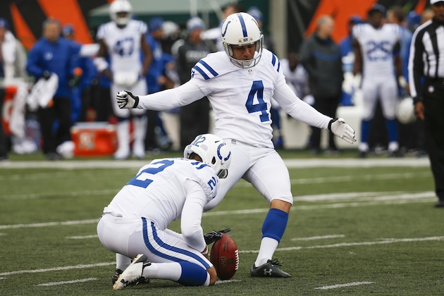 Indianapolis Colts kicker Adam Vinatieri (4) kicks a field goal alongside punter Rigoberto Sanchez (2) in the first half of an NFL football game against the Cincinnati Bengals, Sunday, Oct. 29, 2017, in Cincinnati. (AP Photo/Frank Victores)