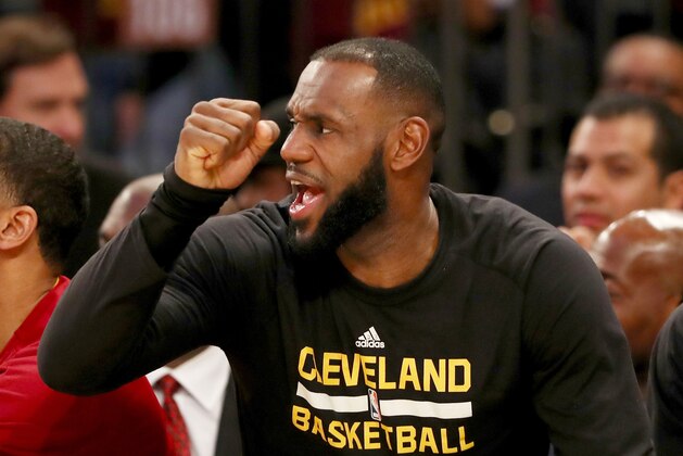 NEW YORK, NY - DECEMBER 07:  LeBron James #23 of the Cleveland Cavaliers celebrates from the bench in the fourth quarter against the New York Knicks at Madison Square Garden on December 7, 2016 in New York City. NOTE TO USER: User expressly acknowledges and agrees that, by downloading and or using this Photograph, user is consenting to the terms and conditions of the Getty Images License Agreement  (Photo by Elsa/Getty Images)