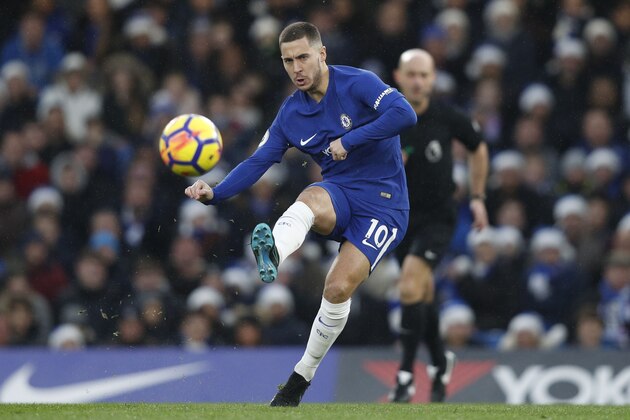 Chelsea's Belgian midfielder Eden Hazard passes the ball during the English Premier League football match between Chelsea and Southampton at Stamford Bridge in London on December 16, 2017. / AFP PHOTO / Adrian DENNIS / RESTRICTED TO EDITORIAL USE. No use with unauthorized audio, video, data, fixture lists, club/league logos or 'live' services. Online in-match use limited to 75 images, no video emulation. No use in betting, games or single club/league/player publications.  /         (Photo credit should read ADRIAN DENNIS/AFP/Getty Images)