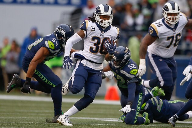 SEATTLE, WA - DECEMBER 17:  Running back Todd Gurley #30 of the Los Angeles Rams rushes for a 57 yard touchdown against the Seattle Seahawks during the 2nd quarter of the game at CenturyLink Field on December 17, 2017 in Seattle, Washington.  (Photo by Otto Greule Jr /Getty Images)