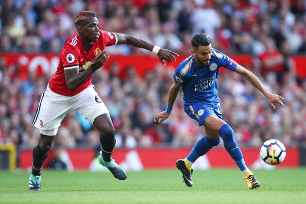 MANCHESTER, ENGLAND - AUGUST 26: Paul Pogba of Manchester United and Riyad Mahrez of Leicester City during the Premier League match between Manchester United and Leicester City at Old Trafford on August 26, 2017 in Manchester, England. (Photo by Robbie Jay Barratt - AMA/Getty Images)