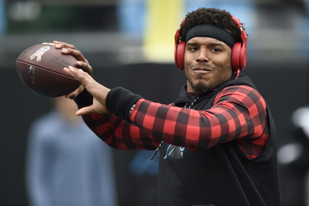 Carolina Panthers' Cam Newton warms up before an NFL football game against the Green Bay Packers in Charlotte, N.C., Sunday, Dec. 17, 2017. (AP Photo/Mike McCarn)