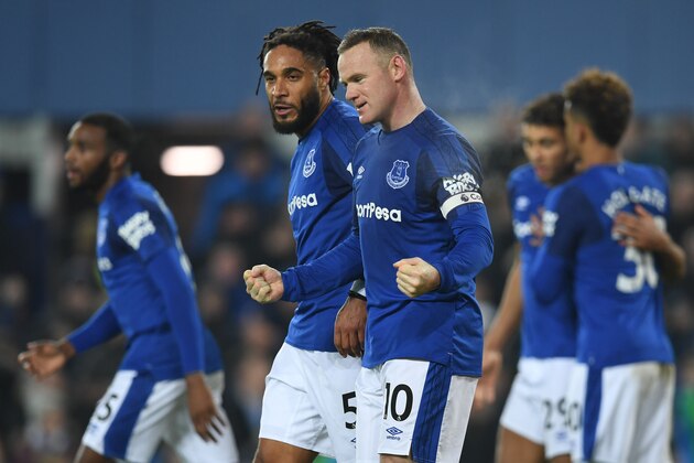 Everton's English striker Wayne Rooney (C) celebrates scoring the penalty during the English Premier League football match between Everton and Swansea City at Goodison Park in Liverpool, north west England on December 18, 2017. / AFP PHOTO / Paul ELLIS / RESTRICTED TO EDITORIAL USE. No use with unauthorized audio, video, data, fixture lists, club/league logos or 'live' services. Online in-match use limited to 75 images, no video emulation. No use in betting, games or single club/league/player publications.  /         (Photo credit should read PAUL ELLIS/AFP/Getty Images)
