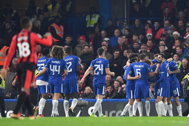 Chelsea's Brazilian midfielder Willian celebrates scoring the team's first goal with teammates during the English League Cup quarter-final football match between Chelsea and Bournemouth at Stamford Bridge Stadium, in southwest London on December 20, 2017. / AFP PHOTO / Ben STANSALL / RESTRICTED TO EDITORIAL USE. No use with unauthorized audio, video, data, fixture lists, club/league logos or 'live' services. Online in-match use limited to 75 images, no video emulation. No use in betting, games or single club/league/player publications.  /         (Photo credit should read BEN STANSALL/AFP/Getty Images)