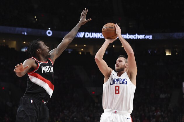 Los Angeles Clippers forward Danilo Gallinari shoots a basket over Portland Trail Blazers forward Al-Farouq Aminu during the first quarter of an NBA basketball game in Portland, Ore., Thursday, Oct. 26, 2017. (AP Photo/Steve Dykes)