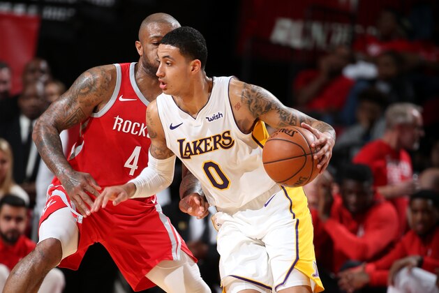 HOUSTON, TX -  DECEMBER  20: Kyle Kuzma #0 of the Los Angeles Lakers handles the ball during the game against the Houston Rockets on December 20, 2017 at Toyota Center in Houston, Texas. NOTE TO USER: User expressly acknowledges and agrees that, by downloading and or using this Photograph, user is consenting to the terms and conditions of the Getty Images License Agreement. Mandatory Copyright Notice: Copyright 2017 NBAE (Photo by David Sherman/NBAE via Getty Images)