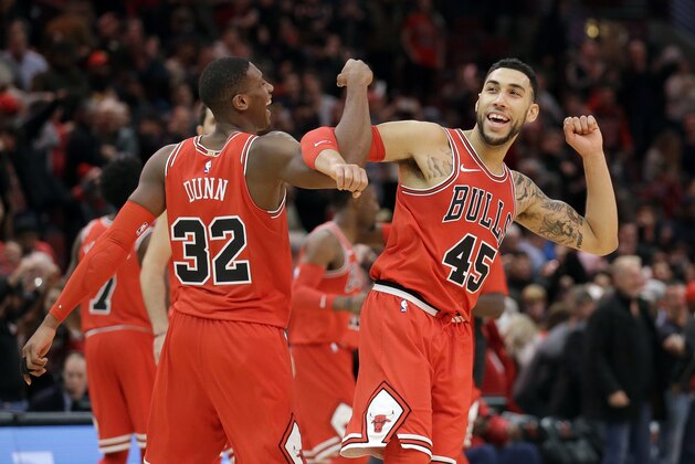 Chicago Bulls guard Kris Dunn, left, celebrates with Denzel Valentine after the Chicago Bulls defeated the Utah Jazz 103-100 in an NBA basketball game Wednesday, Dec. 13, 2017, in Chicago. (AP Photo/Nam Y. Huh)
