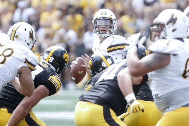 IOWA CITY, IOWA- SEPTEMBER 2:  Quarterback Josh Allen #17 of the Wyoming Cowboys looks for a receiver in the fourth quarter against the Iowa Hawkeyes, on September 2, 2017 at Kinnick Stadium in Iowa City, Iowa.  (Photo by Matthew Holst/Getty Images)
