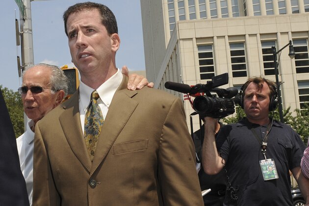 Former NBA referee Tim Donaghy exits Brooklyn federal court following his sentencing, Tuesday, July 29, 2008, in New York. Donaghy received a prison sentence of fifteen months and three years probation after pleading guilty in August, 2007 to federal charges that he took payoffs from a professonal gambler for inside tips on games. (AP Photo/ Louis Lanzano)