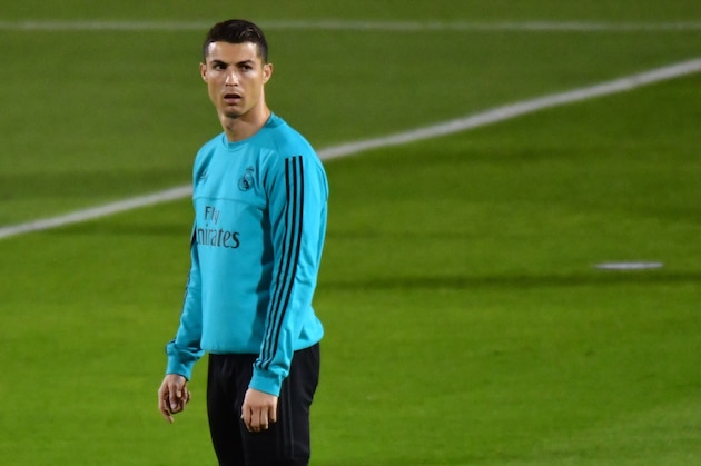 Real Madrid's Portuguese forward Cristiano Ronaldo stands on the pitch during a training session two days prior to their FIFA Club World Cup semi-final match at New York University Abu Dhabi's stadium in the Emirati capital on December 11, 2017. / AFP PHOTO / GIUSEPPE CACACE        (Photo credit should read GIUSEPPE CACACE/AFP/Getty Images)