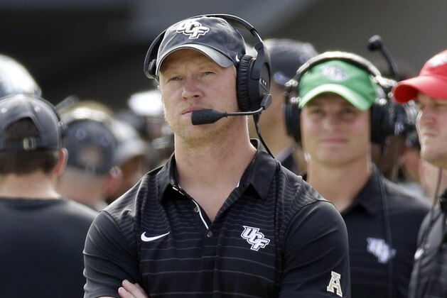 Central Florida head coach Scott Frost looks up at the scoreboard during the first half of the American Athletic Conference championship NCAA college football game against Memphis, Saturday, Dec. 2, 2017, in Orlando, Fla. (AP Photo/John Raoux)