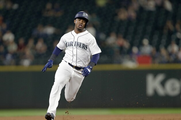 Seattle Mariners' Jean Segura rounds the bases after hitting a triple against the Houston Astros during a baseball game Wednesday, Sept. 6, 2017, in Seattle. (AP Photo/John Froschauer)