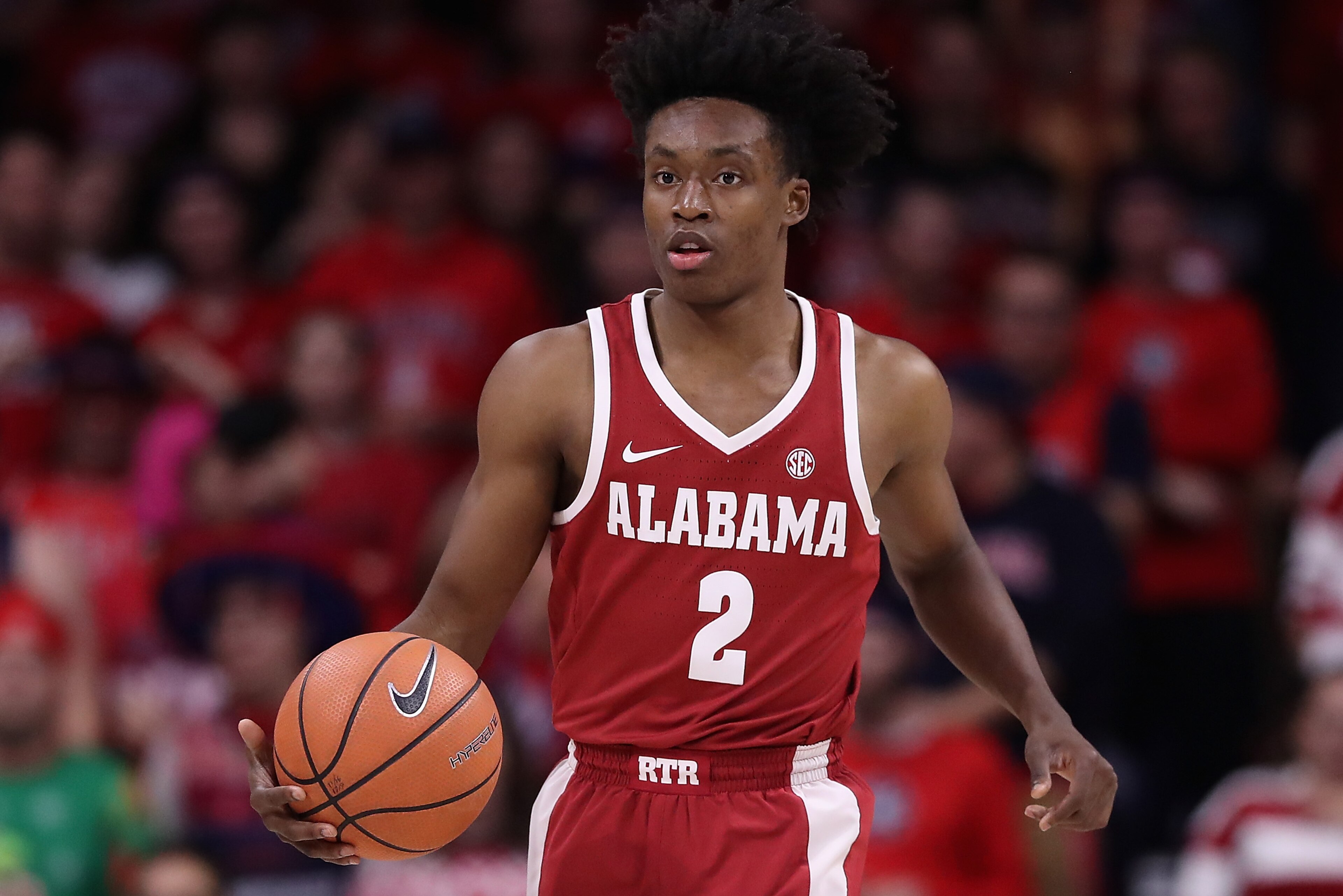TUCSON, AZ - DECEMBER 09:  Collin Sexton #2 of the Alabama Crimson Tide handles the ball during the first half of the college basketball game against the Arizona Wildcats at McKale Center on December 9, 2017 in Tucson, Arizona. The Wildcats defeated the Crimson Tide 88-82.  (Photo by Christian Petersen/Getty Images)