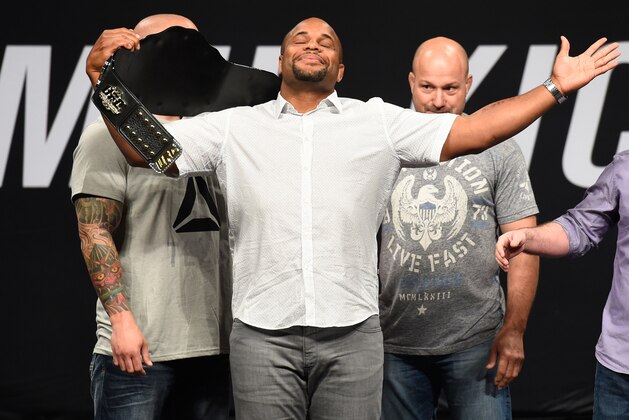 DALLAS, TX - MAY 12:  UFC light heavyweight champion Daniel Cormier raises his belt during the UFC Summer Kickoff Press Conference at the American Airlines Center on May 12, 2017 in Dallas, Texas. (Photo by Josh Hedges/Zuffa LLC/Zuffa LLC via Getty Images)
