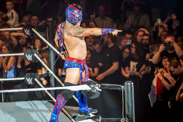 Kalisto celebrates victory during the WWE show at Zenith Arena on may 09, 2017 in Lille, north France. / AFP PHOTO / PHILIPPE HUGUEN        (Photo credit should read PHILIPPE HUGUEN/AFP/Getty Images)