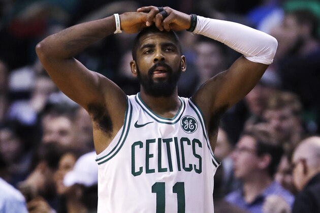 Boston Celtics guard Kyrie Irving (11) reacts after missing an attempt at the game-winning basket during the final seconds of the team's NBA basketball game against the Miami Heat in Boston, Wednesday, Dec. 20, 2017. The Heat defeated the Celtics 90-89. (AP Photo/Charles Krupa)