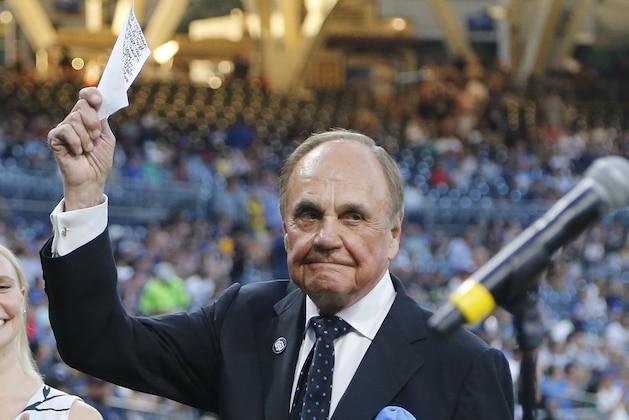San Diego Padres broadcaster Dick Enberg waves to crowd at a retirement ceremony prior to the Padres final home baseball game of the season, against the Los Angeles Dodgers on Thursday, Sept. 29, 2016, in San Diego. (AP Photo/Lenny Ignelzi)
