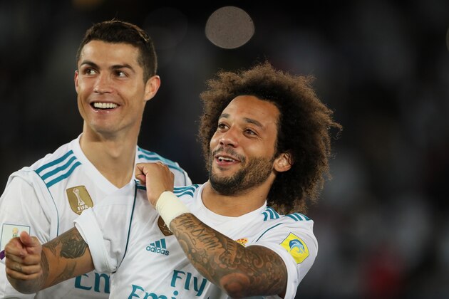 ABU DHABI, UNITED ARAB EMIRATES - DECEMBER 16:   Cristiano Ronaldo and Marcelo of Real Madrid celebrate at the end of the FIFA Club World Cup UAE 2017 final match between Gremio and Real Madrid CF at Zayed Sports City Stadium on December 16, 2017 in Abu Dhabi, United Arab Emirates. (Photo by Matthew Ashton - AMA/Getty Images)