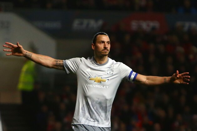 Manchester United's Swedish striker Zlatan Ibrahimovic celebrates scoring the team's first goal during the English League Cup quarter-final football match between Bristol City and Manchester United at Ashton Gate Stadium in Bristol, southwest England on December 20, 2017. / AFP PHOTO / Geoff CADDICK / RESTRICTED TO EDITORIAL USE. No use with unauthorized audio, video, data, fixture lists, club/league logos or 'live' services. Online in-match use limited to 75 images, no video emulation. No use in betting, games or single club/league/player publications.  /         (Photo credit should read GEOFF CADDICK/AFP/Getty Images)