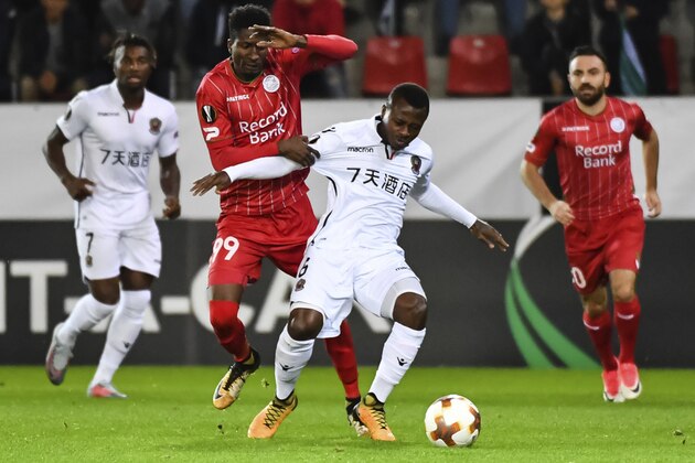 Waregem's Peter Olayinka challenges Nice's Jean Michael Seri, center right, during a Europa League group K soccer match between Zulte Waregem and Nice at the Regenboog stadium in Waregem, Belgium, on Thursday, Sept. 14, 2017. (AP Photo/Geert Vanden Wijngaert)