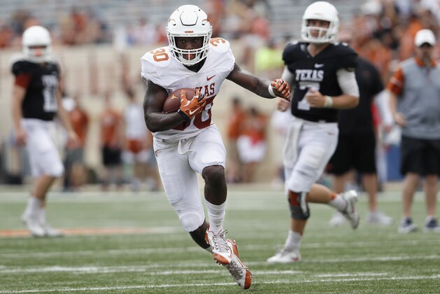 AUSTIN, TX - APRIL 15:  Toneil Carter #30 of the Texas Longhorns carries the ball during the Orange-White Spring Game at Darrell K Royal-Texas Memorial Stadium on April 15, 2017 in Austin, Texas.  (Photo by Tim Warner/Getty Images)