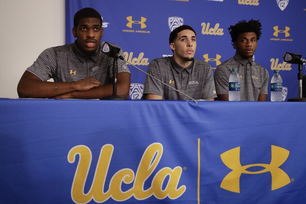 UCLA basketball player Cody Riley, left, reads his statement as he is joined by teammates LiAngelo Ball, center, and Jalen Hill during a news conference at UCLA Wednesday, Nov. 15, 2017, in Los Angeles. Three UCLA NCAA college basketball players accused of shoplifting in China admitted to the crime and apologized before coach Steve Alford announced they were being suspended indefinitely. (AP Photo/Jae C. Hong)