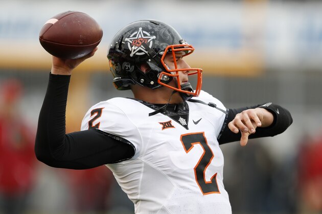Oklahoma State quarterback Mason Rudolph warms up before an NCAA college football game against Iowa State, Saturday, Nov. 11, 2017, in Ames, Iowa. (AP Photo/Charlie Neibergall)