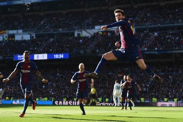 MADRID, SPAIN - DECEMBER 23:  Lionel Messi of Barcelona celebrates after scoring his sides second goal during the La Liga match between Real Madrid and Barcelona at Estadio Santiago Bernabeu on December 23, 2017 in Madrid, Spain.  (Photo by Denis Doyle/Getty Images)
