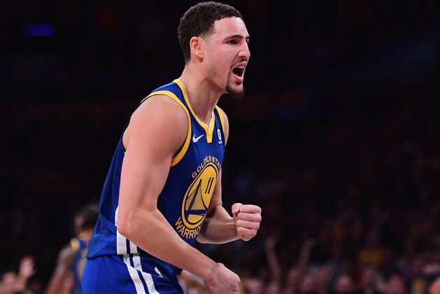 LOS ANGELES, CA - DECEMBER 18:  Klay Thompson #11 of the Golden State Warriors celebrates a 116-114 win over the Los Angeles Lakers at the buzzer at Staples Center on December 18, 2017 in Los Angeles, California.  (Photo by Harry How/Getty Images)