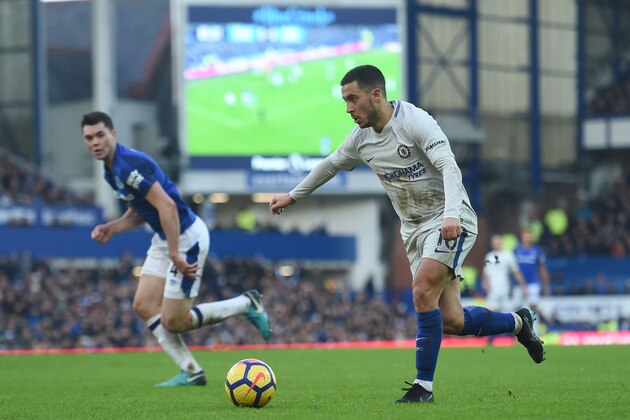 Chelsea's Belgian midfielder Eden Hazard runs with the ball during the English Premier League football match between Everton and Chelsea at Goodison Park in Liverpool, north west England on December 23, 2017.
The game finished 0-0. / AFP PHOTO / PAUL ELLIS / RESTRICTED TO EDITORIAL USE. No use with unauthorized audio, video, data, fixture lists, club/league logos or 'live' services. Online in-match use limited to 75 images, no video emulation. No use in betting, games or single club/league/player publications.  /         (Photo credit should read PAUL ELLIS/AFP/Getty Images)