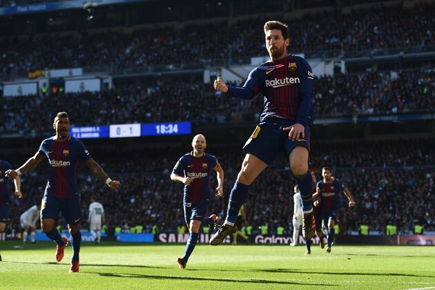 MADRID, SPAIN - DECEMBER 23:  Lionel Messi of Barcelona celebrates after scoring his sides second goal during the La Liga match between Real Madrid and Barcelona at Estadio Santiago Bernabeu on December 23, 2017 in Madrid, Spain.  (Photo by Denis Doyle/Getty Images)