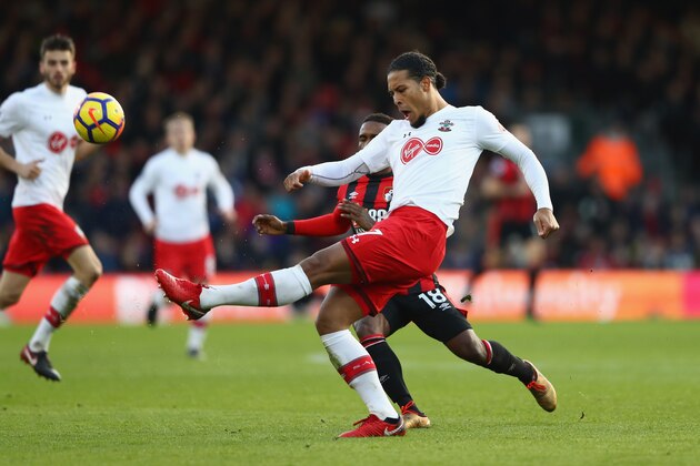 BOURNEMOUTH, ENGLAND - DECEMBER 03: Virgil van Dijk of Southampton clears the ball while under pressure from Jermain Defoe of AFC Bournemouth during the Premier League match between AFC Bournemouth and Southampton at Vitality Stadium on December 3, 2017 in Bournemouth, England.  (Photo by Michael Steele/Getty Images)