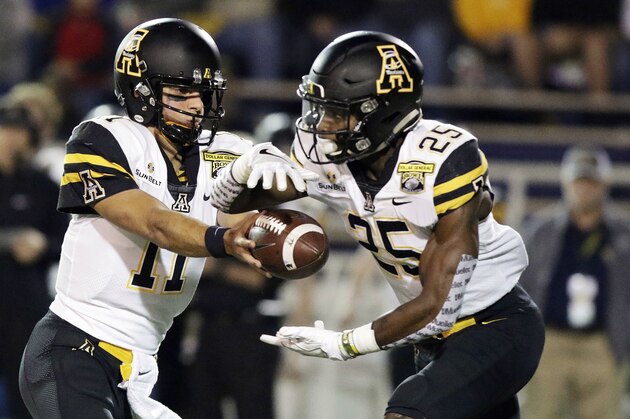 Appalachian State quarterback Taylor Lamb (11) passes the ball to running back Jalin Moore (25) as they play against Toledo in the first half during the Dollar General Bowl NCAA college football game, Saturday, Dec. 23, 2017, in Mobile, Ala. (AP Photo/Dan Anderson)