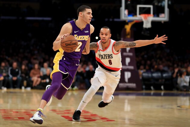 LOS ANGELES, CA - DECEMBER 23:  Lonzo Ball #2 of the Los Angeles Lakers dribbles past Al-Farouq Aminu #8 of the Portland Trail Blazers during the first half of a game at Staples Center on December 23, 2017 in Los Angeles, California. NOTE TO USER: User expressly acknowledges and agrees that, by downloading and or using this photograph, User is consenting to the terms and conditions of the Getty Images License Agreement.  (Photo by Sean M. Haffey/Getty Images)