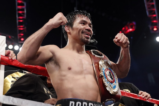 Manny Pacquiao, of the Philippines, celebrates after defeating Jessie Vargas in a WBO welterweight title boxing match Saturday, Nov. 5, 2016, in Las Vegas. (AP Photo/Isaac Brekken)