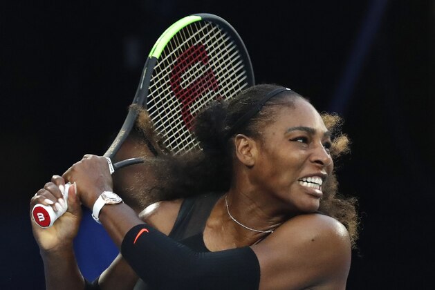 United States' Serena Williams follows through on a backhand return to her sister Venus during the women's singles final at the Australian Open tennis championships in Melbourne, Australia, Saturday, Jan. 28, 2017. (AP Photo/Kin Cheung)