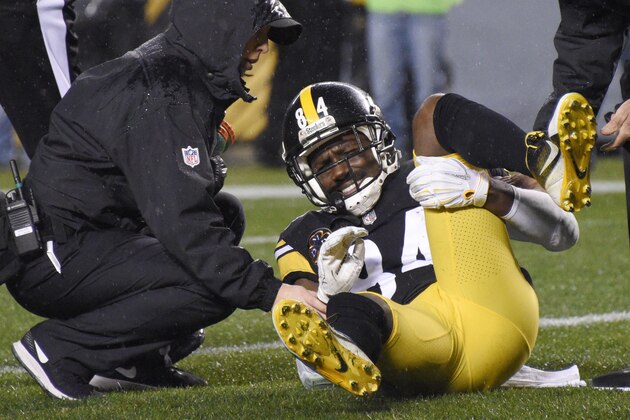 Pittsburgh Steelers wide receiver Antonio Brown (84) is helped by a trainer after being injured during the first half of an NFL football game against the New England Patriots in Pittsburgh, Sunday, Dec. 17, 2017. (AP Photo/Don Wright)