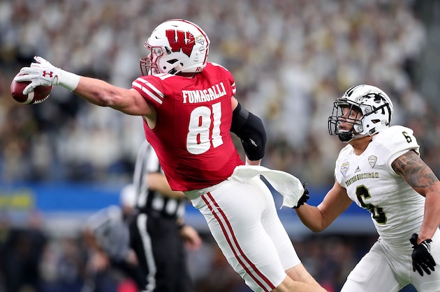 ARLINGTON, TX - JANUARY 02:  Troy Fumagalli #81 of the Wisconsin Badgers dives for the ball in the first quarter during the 81st Goodyear Cotton Bowl Classic between Western Michigan and Wisconsin at AT&T Stadium on January 2, 2017 in Arlington, Texas.  (Photo by Tom Pennington/Getty Images)