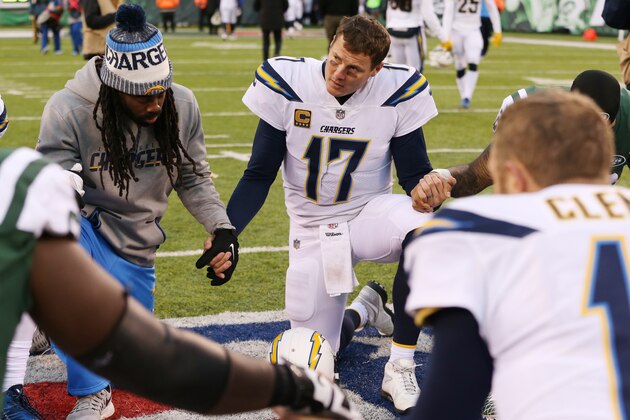 EAST RUTHERFORD, NJ - DECEMBER 24: Philip Rivers #17 of the Los Angeles Chargers kneels at midfield after an NFL game against the New York Jets at MetLife Stadium on December 24, 2017 in East Rutherford, New Jersey. The Los Angeles Chargers defeated the New York Jets 14-7.  (Photo by Ed Mulholland/Getty Images)