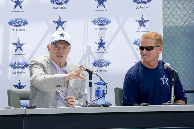 Dallas Cowboys head coach Jason Garrett, right, looks on as Cowboys owner Jerry Jones answers a question during the