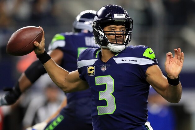 ARLINGTON, TX - DECEMBER 24:  Russell Wilson #3 of the Seattle Seahawks throws against the Dallas Cowboys at AT&T Stadium on December 24, 2017 in Arlington, Texas.  (Photo by Ronald Martinez/Getty Images)
