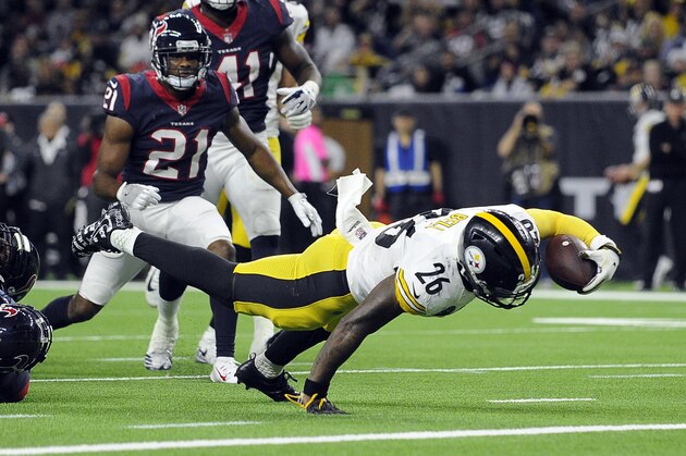 Pittsburgh Steelers running back Le'Veon Bell (26) dives to score a touchdown during the second half of an NFL football game against the Houston Texans Monday, Dec. 25, 2017, in Houston. (AP Photo/Eric Christian Smith)