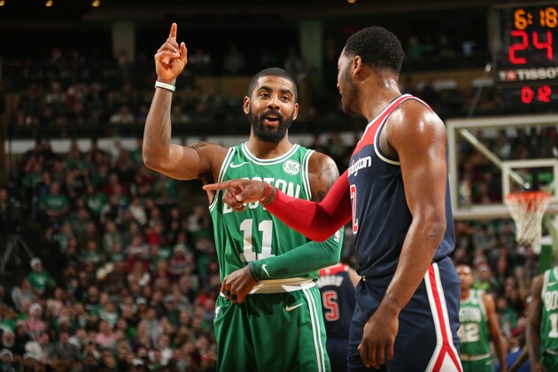 BOSTON, MA - DECEMBER 25:  Kyrie Irving #11 of the Boston Celtics and John Wall #2 of the Washington Wizards speak during the game on December 25, 2017 at the TD Garden in Boston, Massachusetts.  NOTE TO USER: User expressly acknowledges and agrees that, by downloading and or using this photograph, User is consenting to the terms and conditions of the Getty Images License Agreement. Mandatory Copyright Notice: Copyright 2017 NBAE  (Photo by Ned Dishman/NBAE via Getty Images)