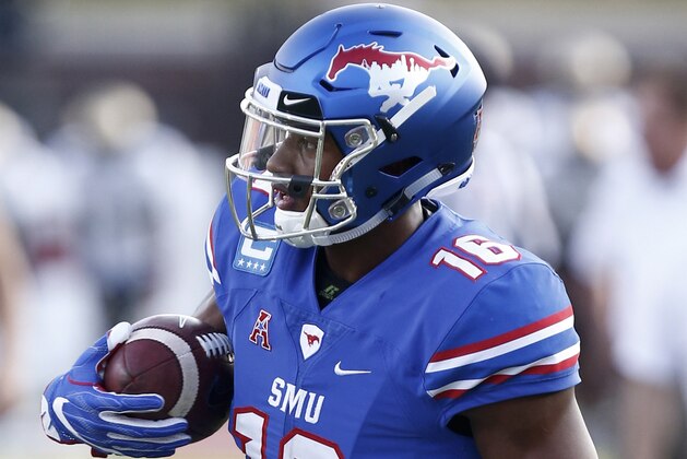 SMU wide receiver Courtland Sutton (16) participates in warm-up drills before the start of an NCAA college football game against Central Florida, Saturday, Nov. 4, 2017, in Dallas. (AP Photo/Mike Stone)