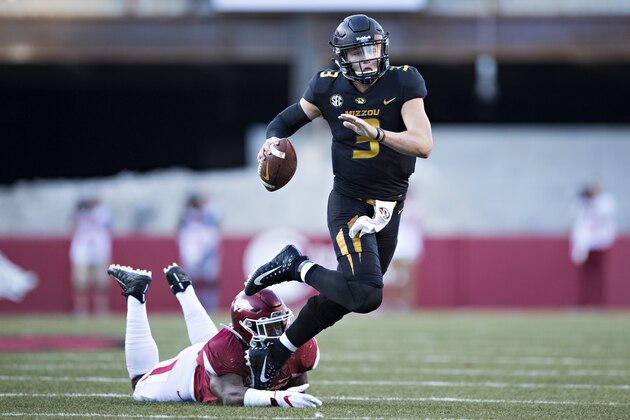 FAYETTEVILLE, AR - NOVEMBER 24:  Drew Lock #3 of the Missouri Tigers runs the ball during a game against the Arkansas Razorbacks at Razorback Stadium on November 24, 2017 in Fayetteville, Arkansas.  The Tigers defeated the Razorbacks 48-45.  (Photo by Wesley Hitt/Getty Images)