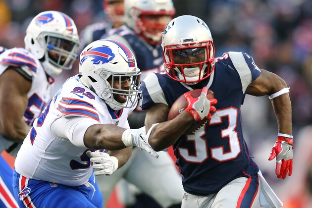 FOXBORO, MA - DECEMBER 24: Dion Lewis #33 of the New England Patriots evades a tackles from LeSean McCoy #25 of the Buffalo Bills during the first half at Gillette Stadium on December 24, 2017 in Foxboro, Massachusetts. (Photo by Maddie Meyer/Getty Images)