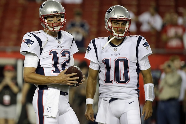 New England Patriots quarterback Tom Brady (12) and quarterback Jimmy Garoppolo (10) warm up before an NFL football game against the Tampa Bay Buccaneers, Thursday, Oct. 5, 2017, in Tampa, Fla. (AP Photo/John Raoux)